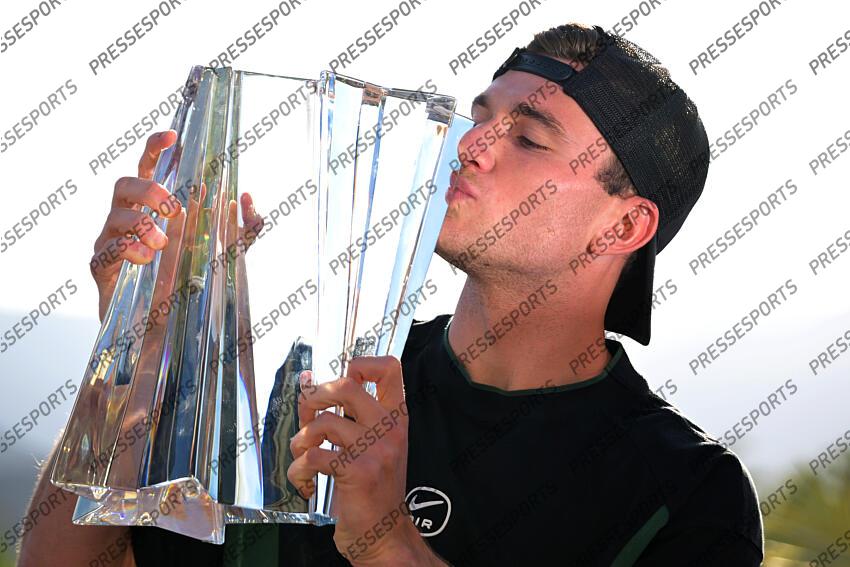 Mar 16, 2025; Indian Wells, CA, USA; Jack Draper (GBR) holds the championship trophy after defeating Holger Rune (not pictured) in the final of the BNP Paribas Open at the Indian Well Tennis Garden. Mandatory Credit: Jayne Kamin-Oncea-Imagn Images Tennis: BNP Paribas Open-Day 15 