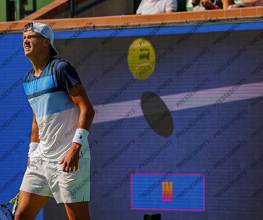 Holger Rune watches a review he requested of a call during the men's championship final of the BNP Paribas Open in Indian Wells, Calif., Sunday, March 16, 2025. Syndication: Desert Sun 
