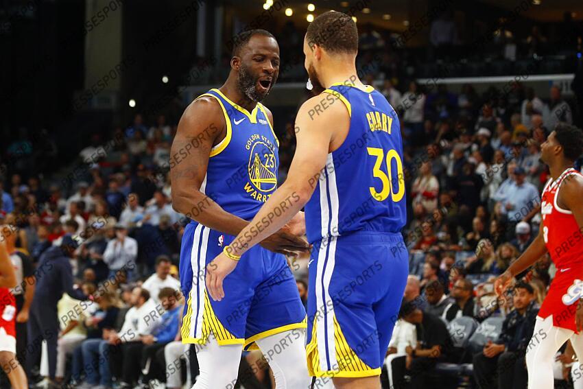 Apr 1, 2025; Memphis, Tennessee, USA; Golden State Warriors forward Draymond Green (23) reacts with Golden State Warriors guard Stephen Curry (30) prior to the game against the Memphis Grizzlies at FedExForum. Mandatory Credit: Petre Thomas-Imagn Images NBA: Golden State Warriors at Memphis Grizzlies 