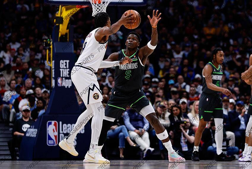Apr 1, 2025; Denver, Colorado, USA; Denver Nuggets forward Peyton Watson (8) passes the ball as Minnesota Timberwolves guard Anthony Edwards (5) guards in the second quarter at Ball Arena. Mandatory Credit: Isaiah J. Downing-Imagn Images NBA: Minnesota Timberwolves at Denver Nuggets 