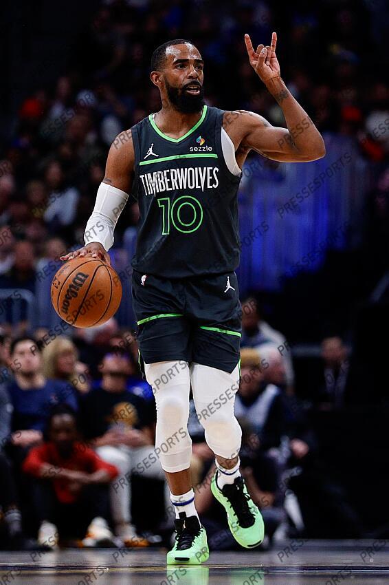 Apr 1, 2025; Denver, Colorado, USA; Minnesota Timberwolves guard Mike Conley (10) gestures as he dribbles the ball up court in the second quarter against the Denver Nuggets at Ball Arena. Mandatory Credit: Isaiah J. Downing-Imagn Images NBA: Minnesota Timberwolves at Denver Nuggets 