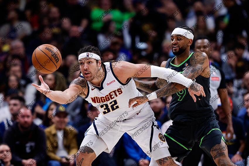 Apr 1, 2025; Denver, Colorado, USA; Denver Nuggets forward Aaron Gordon (32) grabs a pass ahead of Minnesota Timberwolves guard Nickeil Alexander-Walker (9) in the second quarter at Ball Arena. Mandatory Credit: Isaiah J. Downing-Imagn Images NBA: Minnesota Timberwolves at Denver Nuggets 
