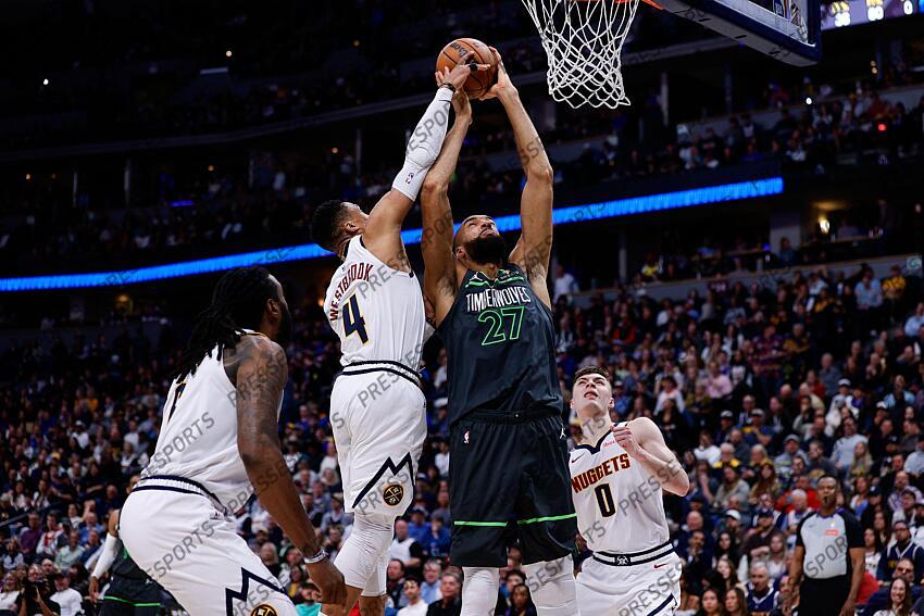 Apr 1, 2025; Denver, Colorado, USA; Denver Nuggets guard Russell Westbrook (4) blocks the shot of Minnesota Timberwolves center Rudy Gobert (27) as center DeAndre Jordan (6) and guard Christian Braun (0) defend in the second quarter at Ball Arena. Mandatory Credit: Isaiah J. Downing-Imagn Images NBA: Minnesota Timberwolves at Denver Nuggets 