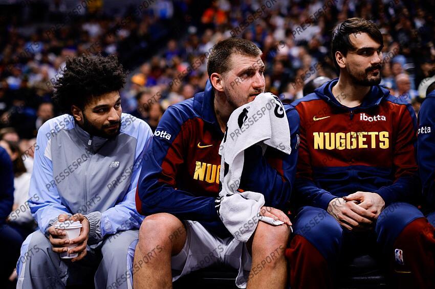 Apr 1, 2025; Denver, Colorado, USA; Denver Nuggets guard Jamal Murray (27) and center Nikola Jokic (15) and forward Dario Saric (9) look on from the bench in the second quarter against the Minnesota Timberwolves at Ball Arena. Mandatory Credit: Isaiah J. Downing-Imagn Images NBA: Minnesota Timberwolves at Denver Nuggets 
