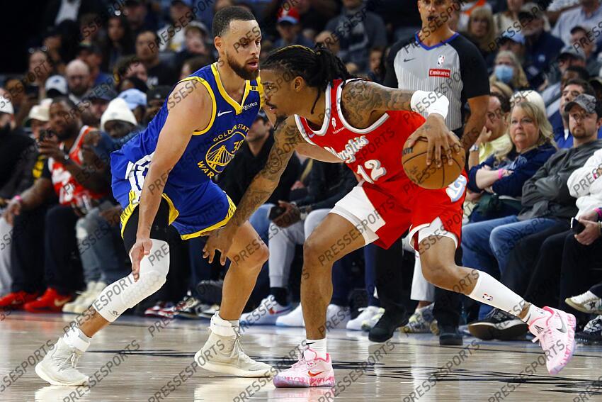 Apr 1, 2025; Memphis, Tennessee, USA; Memphis Grizzlies guard Ja Morant (12) dribbles as Golden State Warriors guard Stephen Curry (30) defends during the fourth quarter at FedExForum. Mandatory Credit: Petre Thomas-Imagn Images NBA: Golden State Warriors at Memphis Grizzlies 