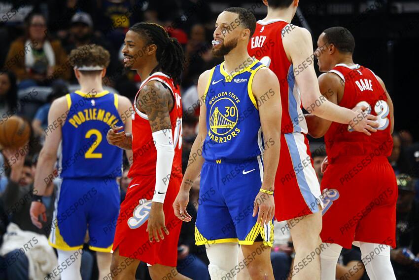Apr 1, 2025; Memphis, Tennessee, USA; Memphis Grizzlies guard Ja Morant (12) and Golden State Warriors guard Stephen Curry (30) react during the third quarter at FedExForum. Mandatory Credit: Petre Thomas-Imagn Images NBA: Golden State Warriors at Memphis Grizzlies 