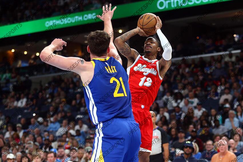 Apr 1, 2025; Memphis, Tennessee, USA; Memphis Grizzlies guard Ja Morant (12) shoots as Golden State Warriors center Quinten Post (21) defends during the second quarter at FedExForum. Mandatory Credit: Petre Thomas-Imagn Images NBA: Golden State Warriors at Memphis Grizzlies 