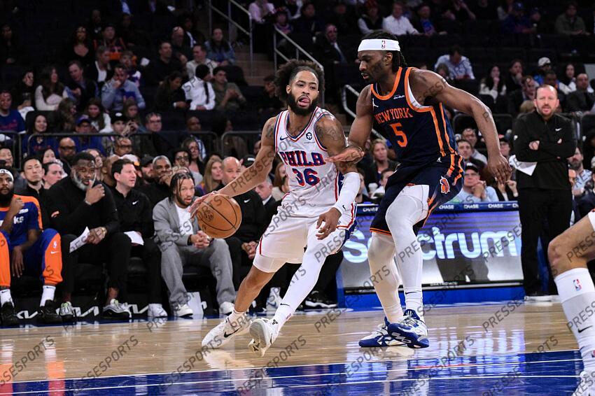 Apr 1, 2025; New York, New York, USA; Philadelphia 76ers forward Phillip Wheeler (36) drives against New York Knicks forward Precious Achiuwa (5) during the second half at Madison Square Garden. Mandatory Credit: John Jones-Imagn Images NBA: Philadelphia 76ers at New York Knicks 