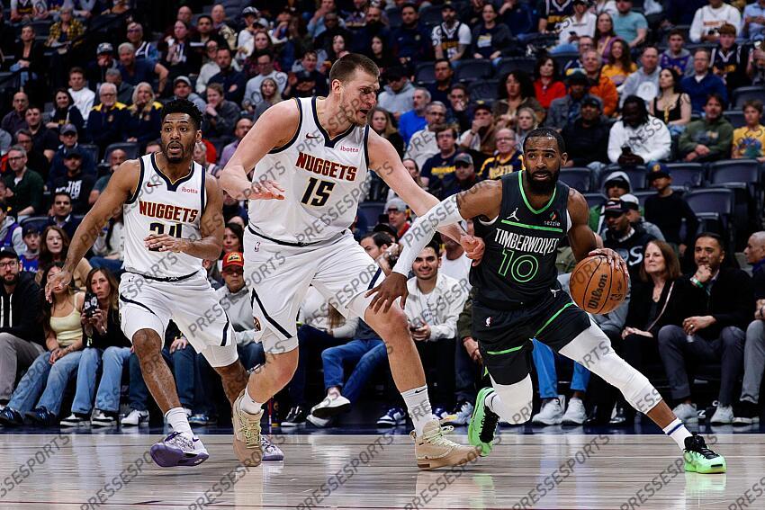 Apr 1, 2025; Denver, Colorado, USA; Minnesota Timberwolves guard Mike Conley (10) controls the ball under pressure from Denver Nuggets center Nikola Jokic (15) as guard Jalen Pickett (24) defends in the first quarter at Ball Arena. Mandatory Credit: Isaiah J. Downing-Imagn Images NBA: Minnesota Timberwolves at Denver Nuggets 