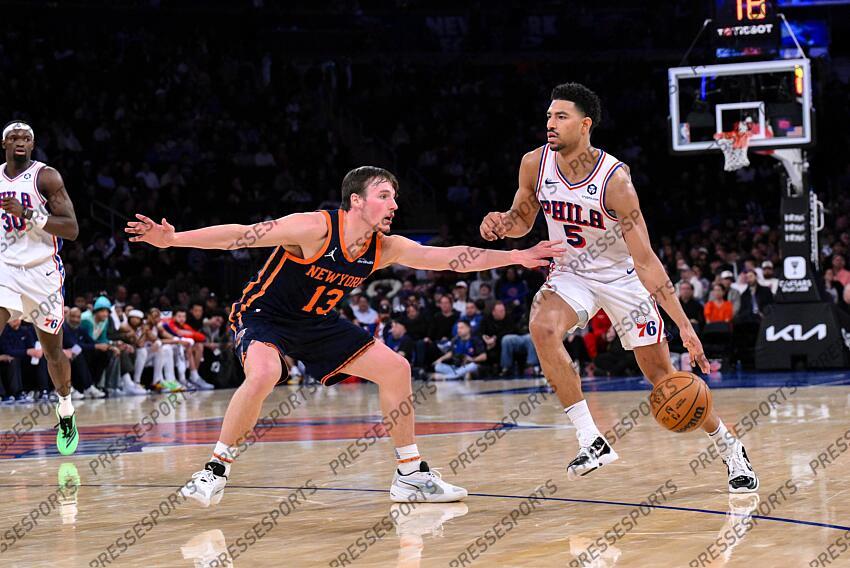 Apr 1, 2025; New York, New York, USA; Philadelphia 76ers guard Quentin Grimes (5) dribbles the ball as New York Knicks guard Tyler Kolek (13) defends during the second half at Madison Square Garden. Mandatory Credit: John Jones-Imagn Images NBA: Philadelphia 76ers at New York Knicks 