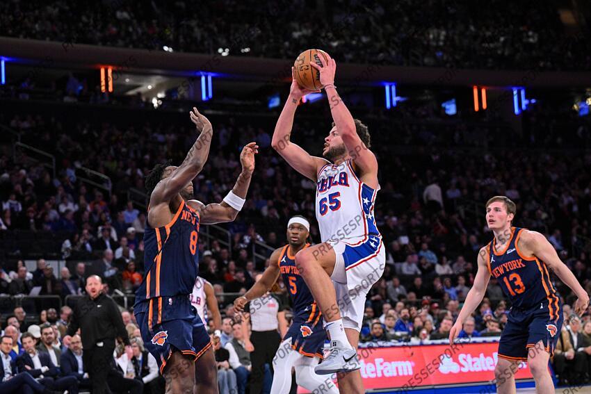 Apr 1, 2025; New York, New York, USA; Philadelphia 76ers forward Alex Reese (65) shoots the ball while being defended by New York Knicks forward OG Anunoby (8) during the second half at Madison Square Garden. Mandatory Credit: John Jones-Imagn Images NBA: Philadelphia 76ers at New York Knicks 