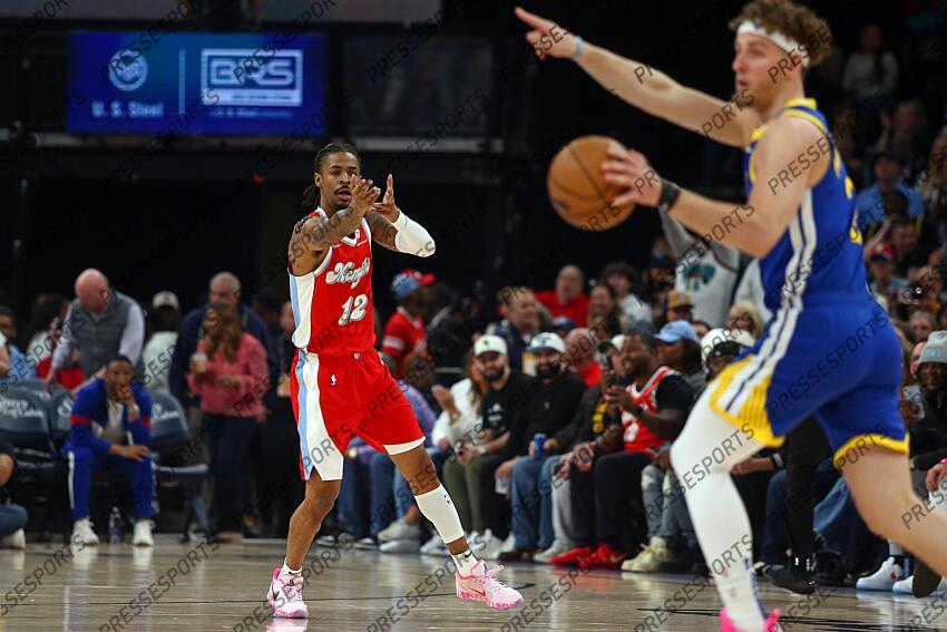 Apr 1, 2025; Memphis, Tennessee, USA; Memphis Grizzlies guard Ja Morant (12) reacts toward Golden State Warriors guard Brandin Podziemski (2) after a basket during the first quarter at FedExForum. Mandatory Credit: Petre Thomas-Imagn Images NBA: Golden State Warriors at Memphis Grizzlies 