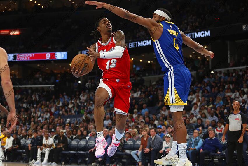 Apr 1, 2025; Memphis, Tennessee, USA; Memphis Grizzlies guard Ja Morant (12) drives to the basket as Golden State Warriors guard Moses Moody (4) defends during the first quarter at FedExForum. Mandatory Credit: Petre Thomas-Imagn Images NBA: Golden State Warriors at Memphis Grizzlies 