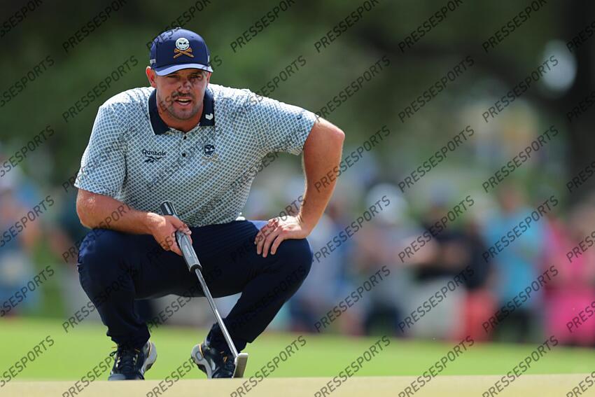 Apr 5, 2025; Miami, Florida, USA; Bryson DeChambeau lines up a putt on the second green during the second round of the LIV Golf Miami golf tournament at Trump National Doral. Mandatory Credit: Sam Navarro-Imagn Images Golf: LIV Golf Miami - Second Round 