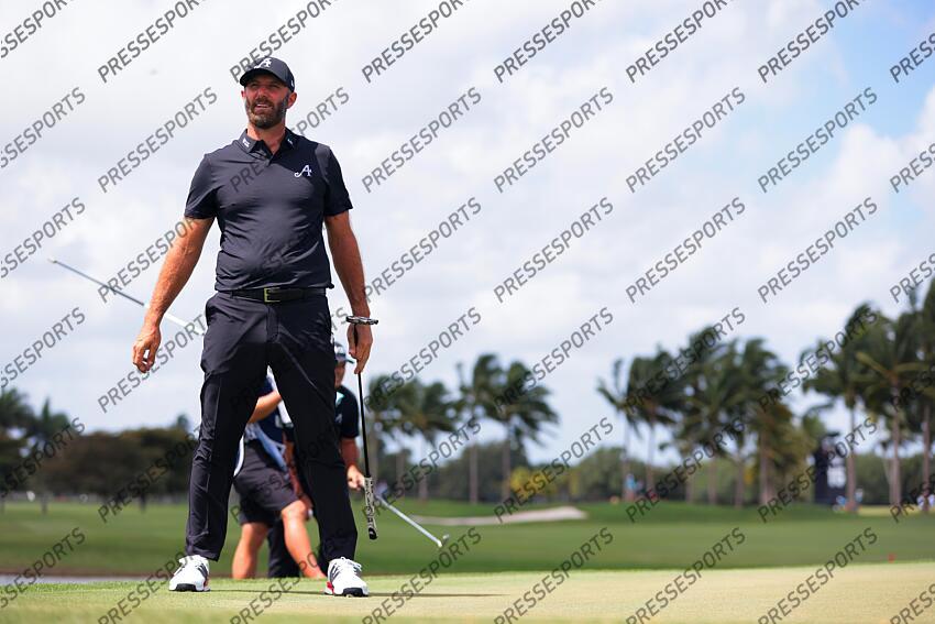 Apr 5, 2025; Miami, Florida, USA; Dustin Johnson reacts after putting on the third green during the second round of the LIV Golf Miami golf tournament at Trump National Doral. Mandatory Credit: Sam Navarro-Imagn Images Golf: LIV Golf Miami - Second Round 