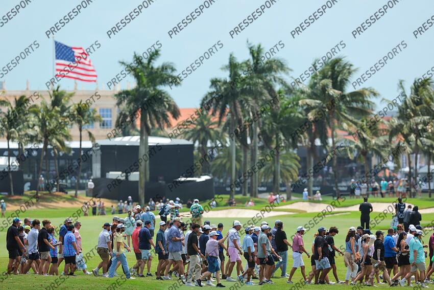 Apr 5, 2025; Miami, Florida, USA; Fans cross the fairway on the eighth hole during the second round of the LIV Golf Miami golf tournament at Trump National Doral. Mandatory Credit: Sam Navarro-Imagn Images Golf: LIV Golf Miami - Second Round 