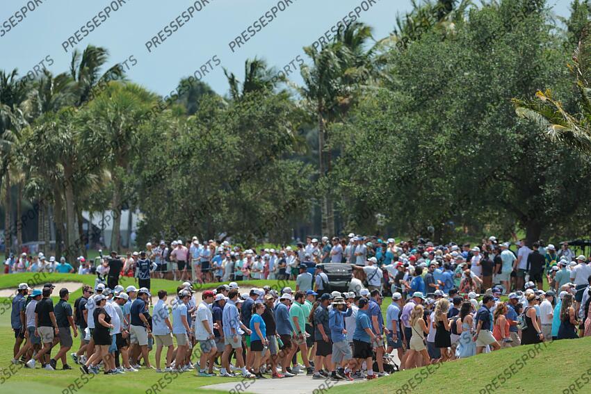 Apr 5, 2025; Miami, Florida, USA; Fans cross the fairway on the eighth hole during the second round of the LIV Golf Miami golf tournament at Trump National Doral. Mandatory Credit: Sam Navarro-Imagn Images Golf: LIV Golf Miami - Second Round 