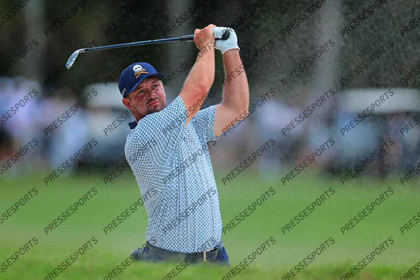 Apr 5, 2025; Miami, Florida, USA; Bryson DeChambeau plays a shot from a bunker on the tenth hole during the second round of the LIV Golf Miami golf tournament at Trump National Doral. Mandatory Credit: Sam Navarro-Imagn Images Golf: LIV Golf Miami - Second Round 
