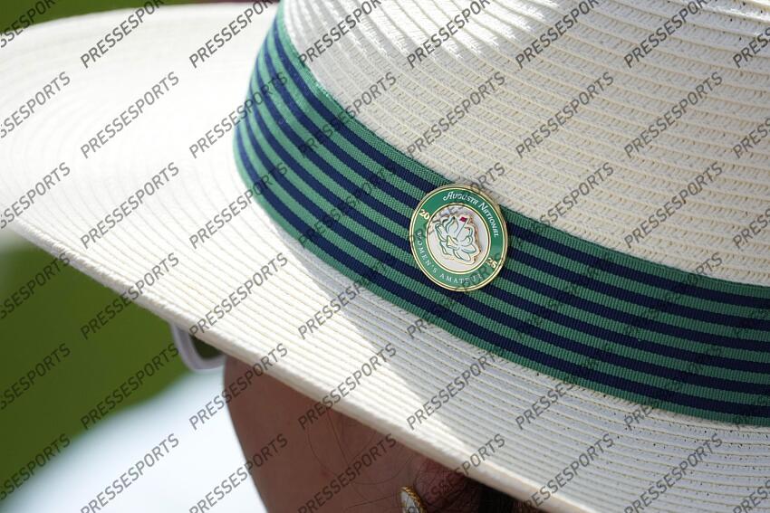 Apr 5, 2025; Augusta, Georgia, USA; Detail view of a female patron hat on the 18th hole during the final round of the Augusta National Women's Amateur golf tournament at Augusta National Golf Club. Mandatory Credit: Michael Madrid-Imagn Images Golf: Augusta National Women's Amateur - Final Round 