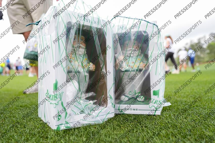 Apr 5, 2025; Augusta, Georgia, USA; A patron purchased merchandise including two gnomes during the final round of the Augusta National Women's Amateur golf tournament at Augusta National Golf Club. Mandatory Credit: Katie Goodale-Imagn Images Golf: Augusta National Women's Amateur - Final Round 