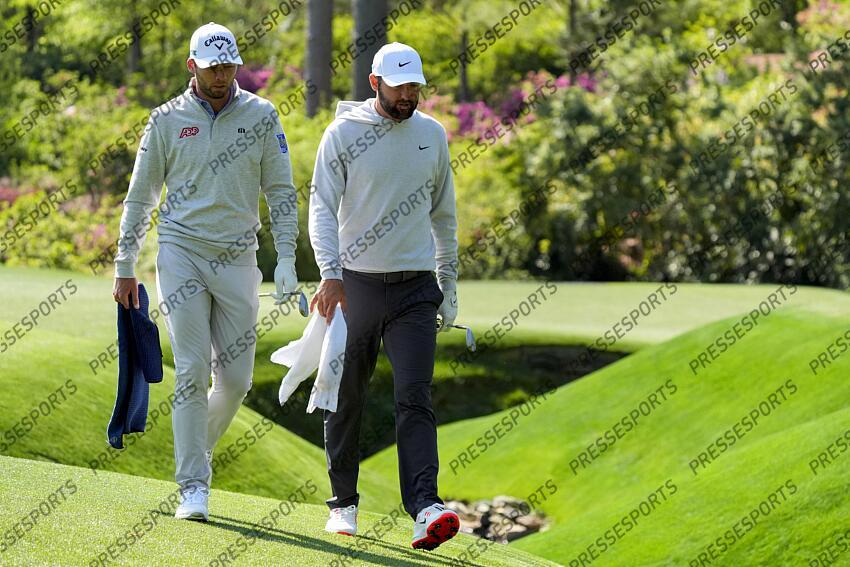 Apr 9, 2025; Augusta, Georgia, USA; Sam Burns and Scottie Scheffler walk beside Rae’s Creek on no. 13 during a practice round for the Masters Tournament at Augusta National Golf Club. Mandatory Credit: Katie Goodale-Imagn Images PGA: Masters Tournament - Practice Round 