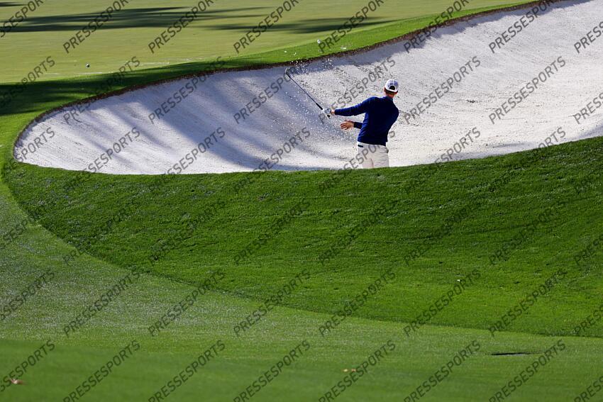 Apr 9, 2025; Augusta, Georgia, USA; Cameron Davis plays from the bunker on the tenth green during a practice round for the Masters Tournament at Augusta National Golf Club. Mandatory Credit: Peter Casey-Imagn Images PGA: Masters Tournament - Practice Round 