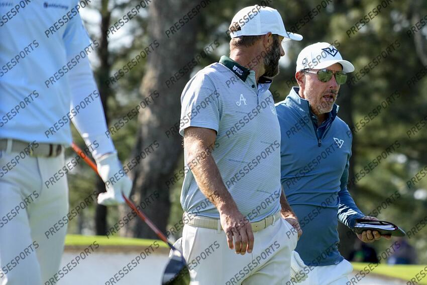 Apr 9, 2025; Augusta, Georgia, USA; Dustin Johnson talks with Phil Mickelson as the walk off the no. 3 tee box during a practice round for the Masters Tournament at Augusta National Golf Club. Mandatory Credit: Kyle Terada-Imagn Images PGA: Masters Tournament - Practice Round 