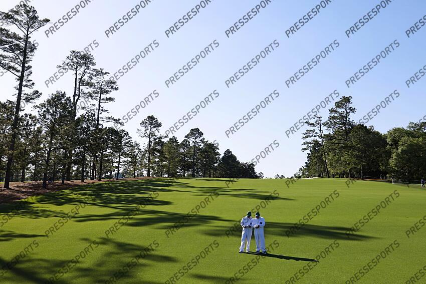 Apr 8, 2025; Augusta, Georgia, USA; Caddy’s look at their yardage book during a practice round for the Masters Tournament at Augusta National Golf Club. Mandatory Credit: Peter Casey-Imagn Images PGA: Masters Tournament - Practice Round 