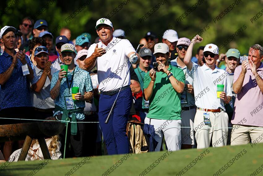 Apr 8, 2025; Augusta, Georgia, USA; Bryson DeChambeau reacts with patrons on the tenth green during a practice round for the Masters Tournament at Augusta National Golf Club. Mandatory Credit: Peter Casey-Imagn Images PGA: Masters Tournament - Practice Round 