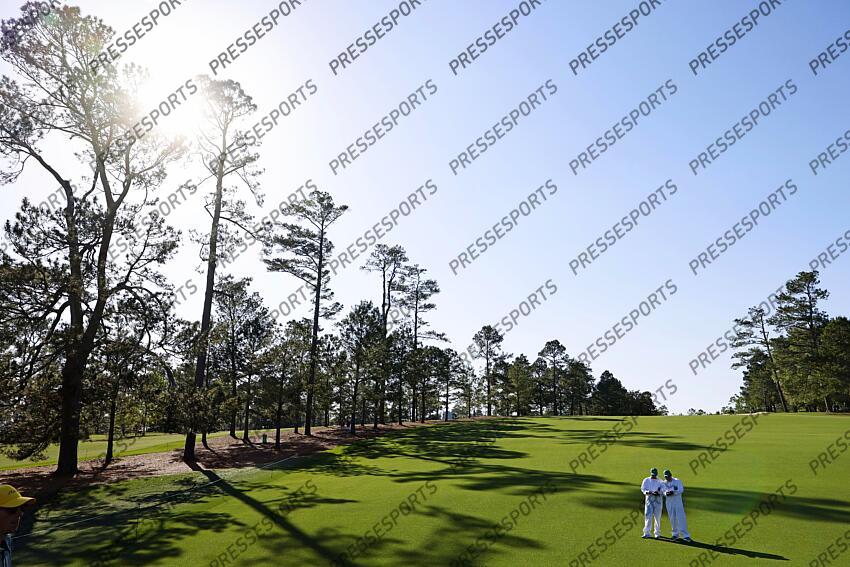 Apr 8, 2025; Augusta, Georgia, USA; Caddy’s look at their yardage book during a practice round for the Masters Tournament at Augusta National Golf Club. Mandatory Credit: Peter Casey-Imagn Images PGA: Masters Tournament - Practice Round 