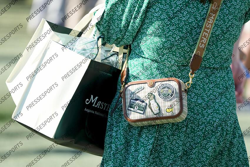 Apr 8, 2025; Augusta, Georgia, USA; A patron’s Masters purse is seen near the no. 1 fairway during a practice round of the Masters Tournament at Augusta National Golf Club. Mandatory Credit: Kyle Terada-Imagn Images PGA: Masters Tournament - Practice Round 