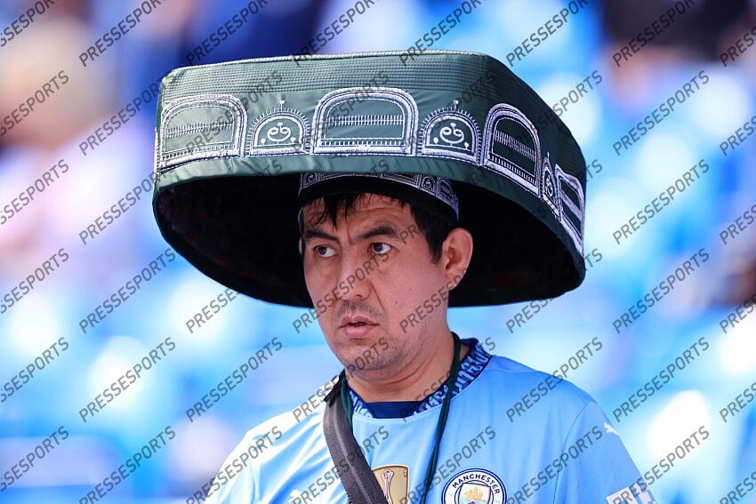 12th April 2025 - Premier League - Manchester City v Crystal Palace - A fan shows his support for Abdukodir Khusanov of Manchester City by wearing a traditional hat from Uzbekistan - Photo: Simon Stacpoole / Offside. MANCHESTER CITY-CRYSTAL PALACE (5-2) 