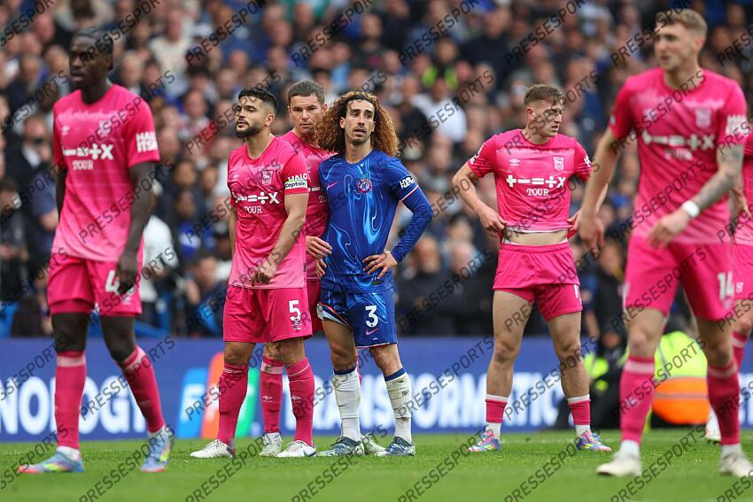 13 April 2025, London - Premier League Football - Chelsea v Ipswich Town - Marc Cucurella of Chelsea stands amongst Ipswich players - Photo: Charlotte Wilson / Offside. CHELSEA-IPSWICH (2-2) 