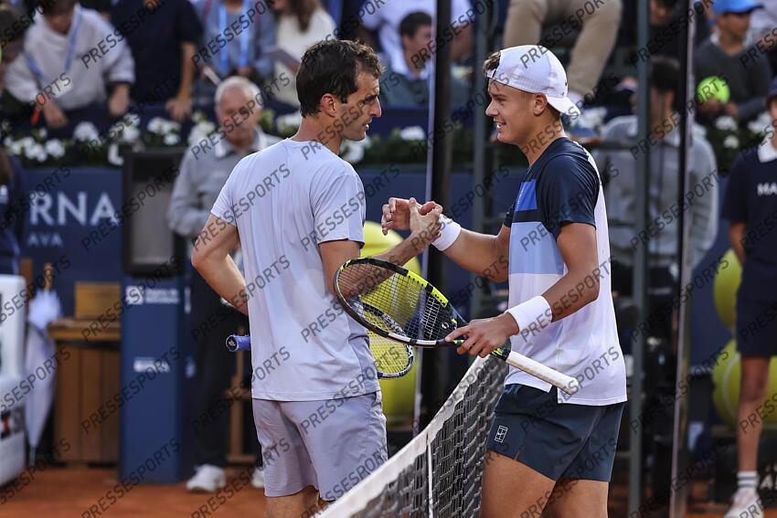 Albert Ramos-Vinolas of Spain shakes hands with Holge Rune of Denmark during the first round tennis match of the Barcelona Open Banc Sabadell - Conde Godo 2025 Day 1 at Real Club De Tenis Barcelona on April 14, 2025 in Barcelona, Spain. OPEN DE BARCELONE 