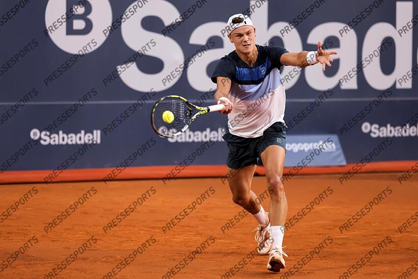 Holge Rune of Denmark in actions against Albert Ramos-Vinolas of Spain during the first round tennis match of the Barcelona Open Banc Sabadell - Conde Godo 2025 Day 1 at Real Club De Tenis Barcelona on April 14, 2025 in Barcelona, Spain. OPEN DE BARCELONE 