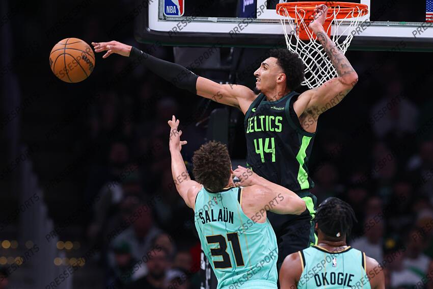 Apr 13, 2025; Boston, Massachusetts, USA; Boston Celtics forward Miles Norris (44) blocks Charlotte Hornets forward Tidjane Salaun (31) during the first half at TD Garden. Mandatory Credit: Paul Rutherford-Imagn Images NBA: Charlotte Hornets at Boston Celtics 