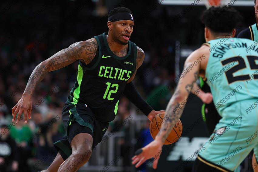 Apr 13, 2025; Boston, Massachusetts, USA; Boston Celtics forward Torrey Craig (12) dribbles down the court during the first half against the Charlotte Hornets at TD Garden. Mandatory Credit: Paul Rutherford-Imagn Images NBA: Charlotte Hornets at Boston Celtics 