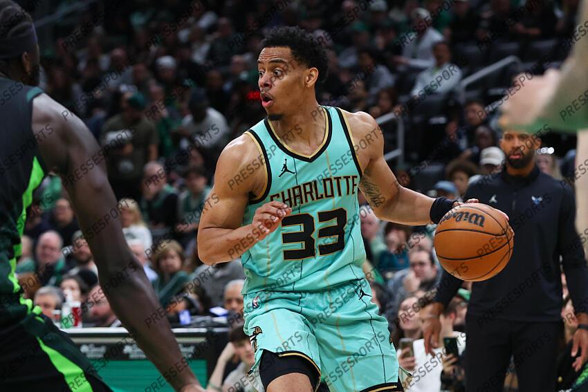 Apr 13, 2025; Boston, Massachusetts, USA; Charlotte Hornets guard Jaylen Sims (33) dribbles down the court during the second half against the Boston Celtics at TD Garden. Mandatory Credit: Paul Rutherford-Imagn Images NBA: Charlotte Hornets at Boston Celtics 