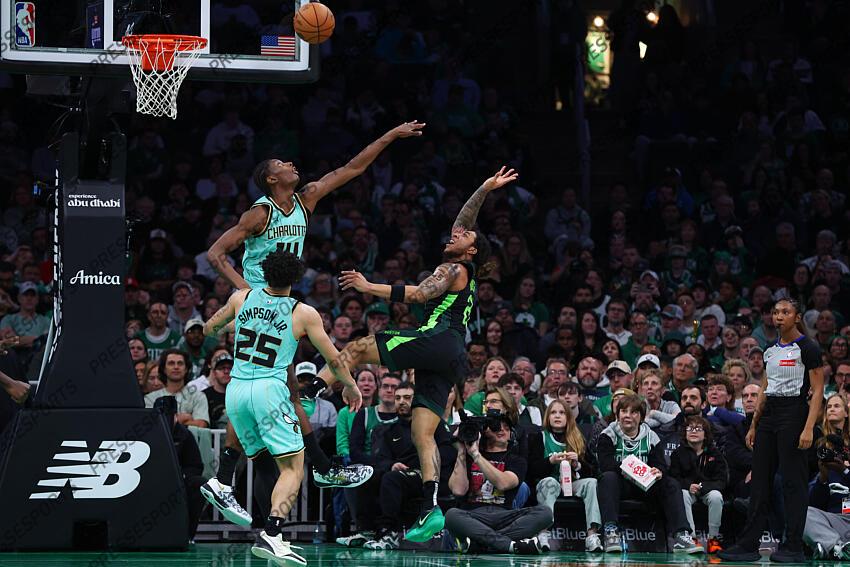Apr 13, 2025; Boston, Massachusetts, USA; Boston Celtics guard JD Davison (20) shoots over Charlotte Hornets forward Moussa Diabate (14) during the second half at TD Garden. Mandatory Credit: Paul Rutherford-Imagn Images NBA: Charlotte Hornets at Boston Celtics 