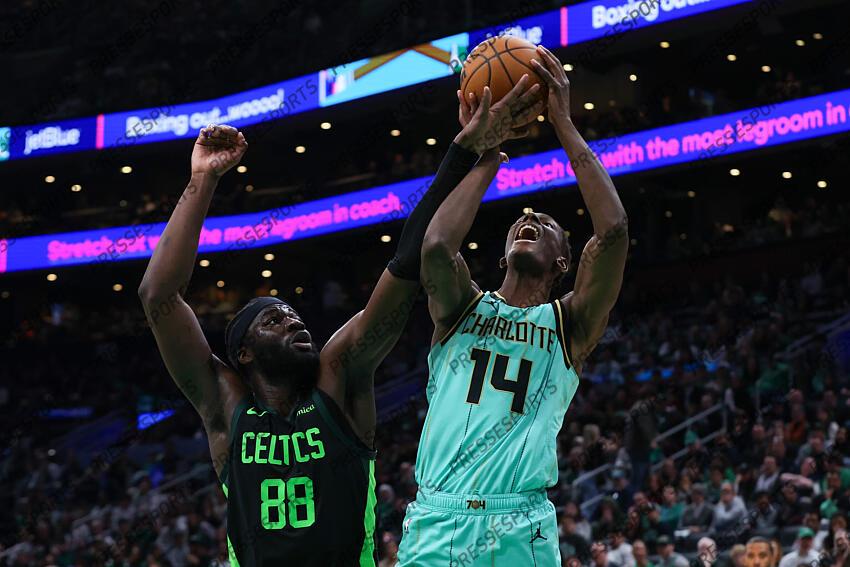 Apr 13, 2025; Boston, Massachusetts, USA; Boston Celtics center Neemias Queta (88) fouls Charlotte Hornets forward Moussa Diabate (14) during the second half at TD Garden. Mandatory Credit: Paul Rutherford-Imagn Images NBA: Charlotte Hornets at Boston Celtics 