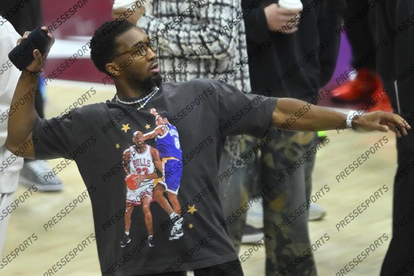 Apr 13, 2025; Cleveland, Ohio, USA; Cleveland Cavaliers guard Donovan Mitchell (45) throws a t-shirt to a fan in the third quarter against the Indiana Pacers at Rocket Arena. Mandatory Credit: David Richard-Imagn Images NBA: Indiana Pacers at Cleveland Cavaliers 