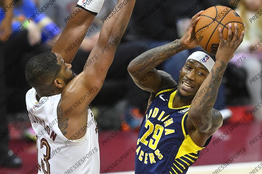 Apr 13, 2025; Cleveland, Ohio, USA; Indiana Pacers guard Quenton Jackson (29) looks to pass beside Cleveland Cavaliers center Tristan Thompson (13) in the third quarter at Rocket Arena. Mandatory Credit: David Richard-Imagn Images NBA: Indiana Pacers at Cleveland Cavaliers 