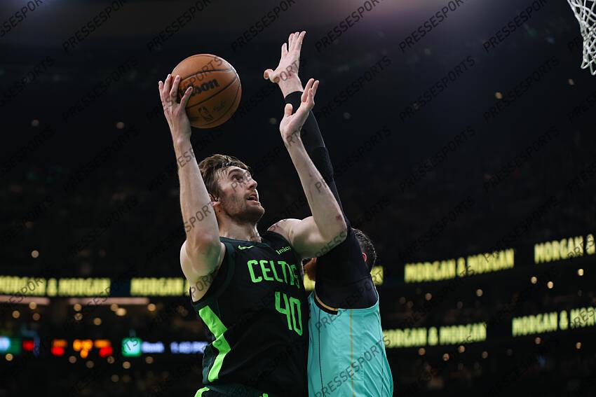 Apr 13, 2025; Boston, Massachusetts, USA; Boston Celtics center Luke Kornet (40) shoots during the first half against the Charlotte Hornets at TD Garden. Mandatory Credit: Paul Rutherford-Imagn Images NBA: Charlotte Hornets at Boston Celtics 