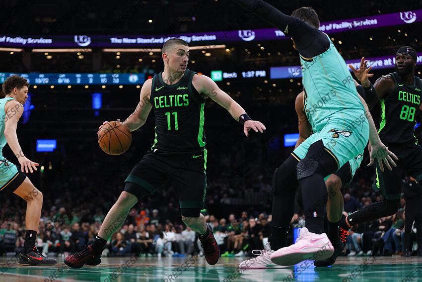 Apr 13, 2025; Boston, Massachusetts, USA; Boston Celtics guard Payton Pritchard (11) drives to the basket during the first half against the Charlotte Hornets at TD Garden. Mandatory Credit: Paul Rutherford-Imagn Images NBA: Charlotte Hornets at Boston Celtics 