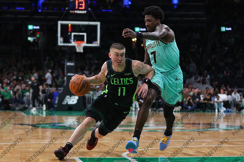 Apr 13, 2025; Boston, Massachusetts, USA; Boston Celtics guard Payton Pritchard (11) drives to the basket defended by Charlotte Hornets guard Damion Baugh (7) during the first half at TD Garden. Mandatory Credit: Paul Rutherford-Imagn Images NBA: Charlotte Hornets at Boston Celtics 