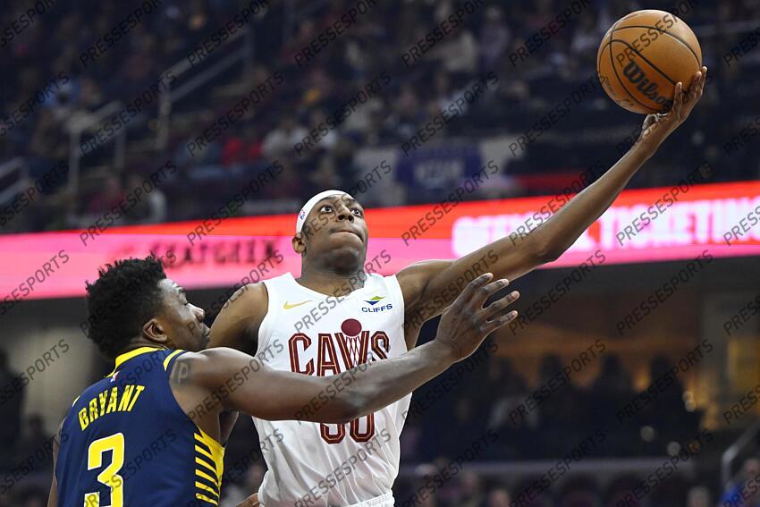 Apr 13, 2025; Cleveland, Ohio, USA; Cleveland Cavaliers forward Nae'Qwan Tomlin (30) drives against Indiana Pacers center Thomas Bryant (3) in the first quarter at Rocket Arena. Mandatory Credit: David Richard-Imagn Images NBA: Indiana Pacers at Cleveland Cavaliers 