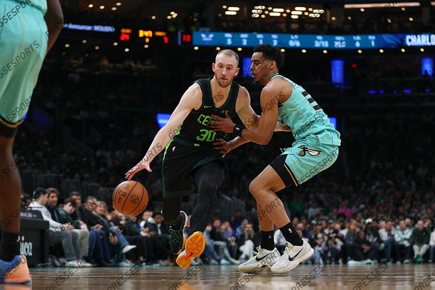 Apr 13, 2025; Boston, Massachusetts, USA; Boston Celtics forward Sam Hauser (30) dribbles down the court during the first half against the Charlotte Hornets at TD Garden. Mandatory Credit: Paul Rutherford-Imagn Images NBA: Charlotte Hornets at Boston Celtics 