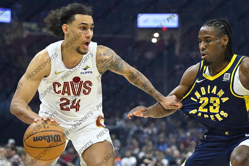 Apr 13, 2025; Cleveland, Ohio, USA; Cleveland Cavaliers forward Jaylon Tyson (24) dribbles beside Indiana Pacers forward Aaron Nesmith (23) in the first quarter at Rocket Arena. Mandatory Credit: David Richard-Imagn Images NBA: Indiana Pacers at Cleveland Cavaliers 