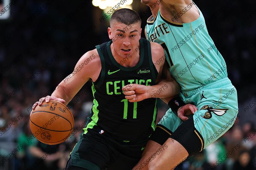 Apr 13, 2025; Boston, Massachusetts, USA; Boston Celtics guard Payton Pritchard (11) drives to the basket during the first half against the Charlotte Hornets at TD Garden. Mandatory Credit: Paul Rutherford-Imagn Images NBA: Charlotte Hornets at Boston Celtics 