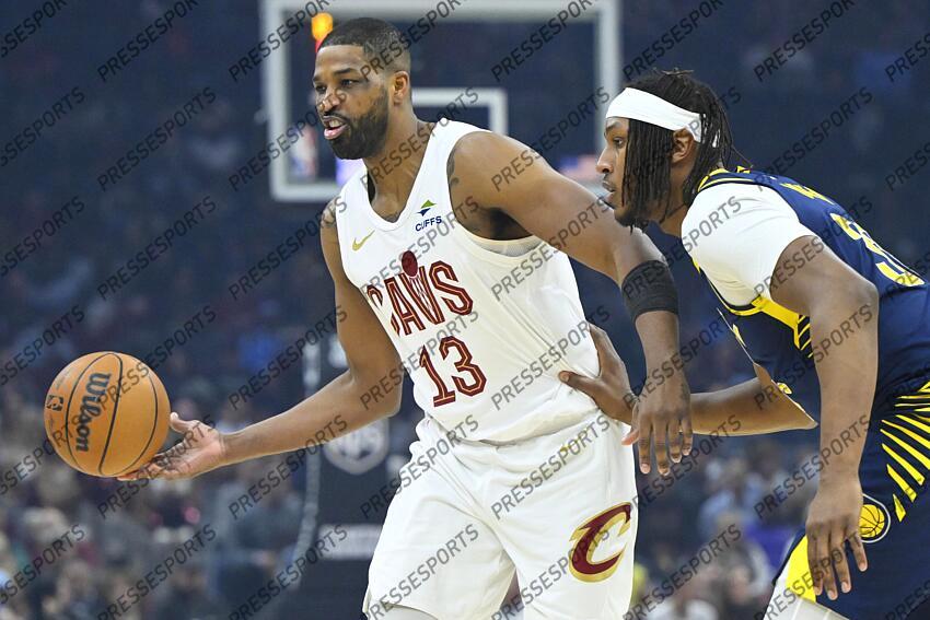 Apr 13, 2025; Cleveland, Ohio, USA; Cleveland Cavaliers center Tristan Thompson (13) passes the ball beside Indiana Pacers center Myles Turner (33) in the first quarter at Rocket Arena. Mandatory Credit: David Richard-Imagn Images NBA: Indiana Pacers at Cleveland Cavaliers 